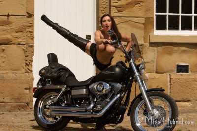 Hybrid technology Miss Hybrid leathers and thigh boots on motorcycle